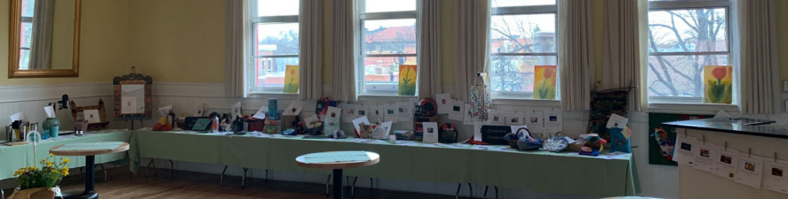 Photo of the silent auction table during the Spring Into Our Future event